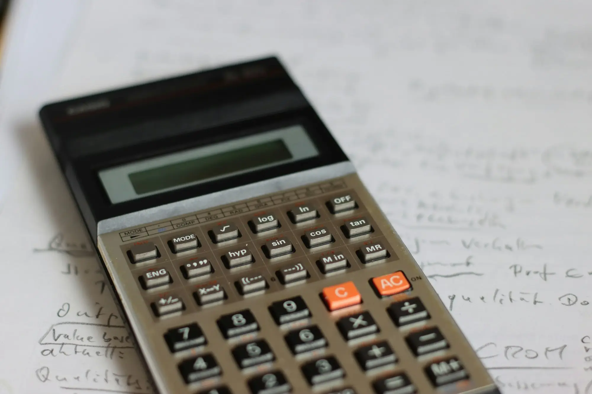 Cafe owner calculating figures counter
