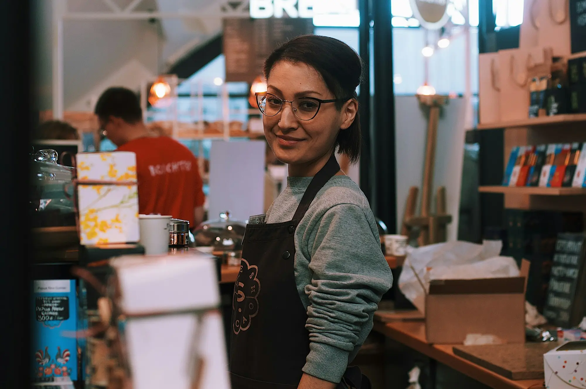 Cafe owner reviewing the accounts on a tablet