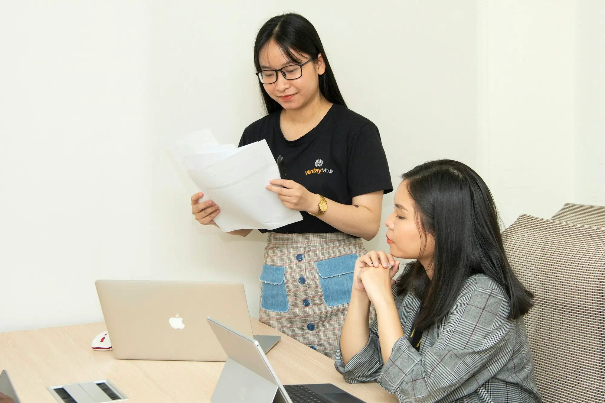 Owner comparing loan offers laptop studio