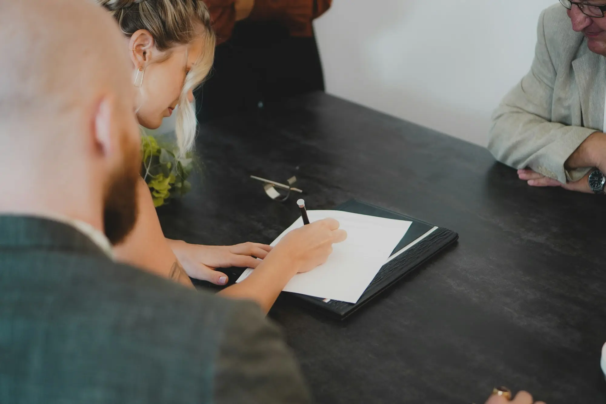 Owner signing loan documents