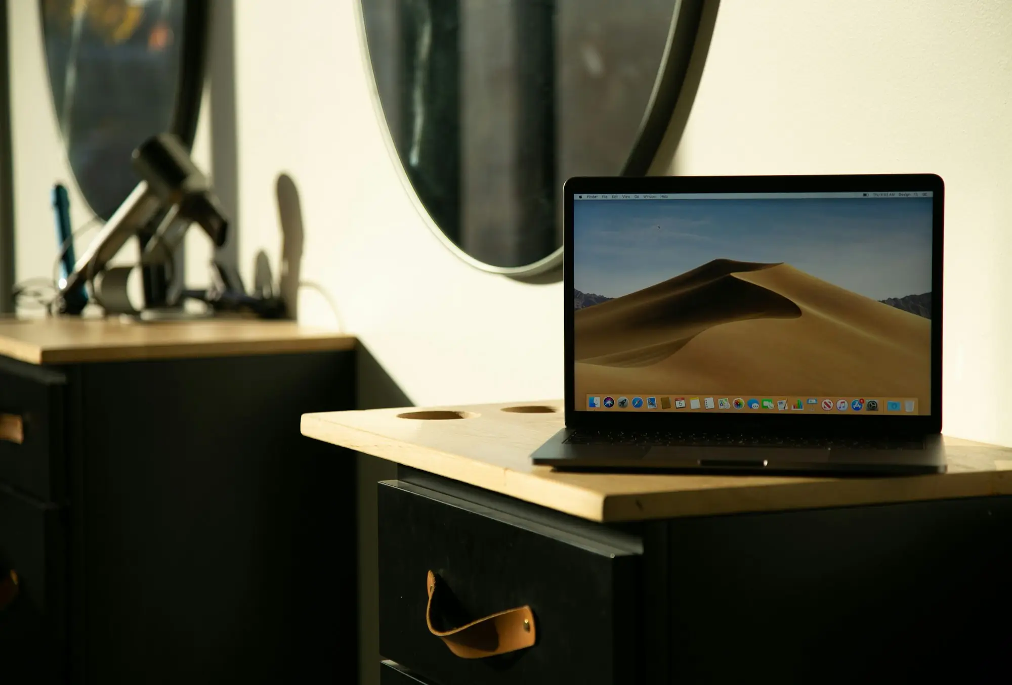 Salon owner reviewing takings laptop