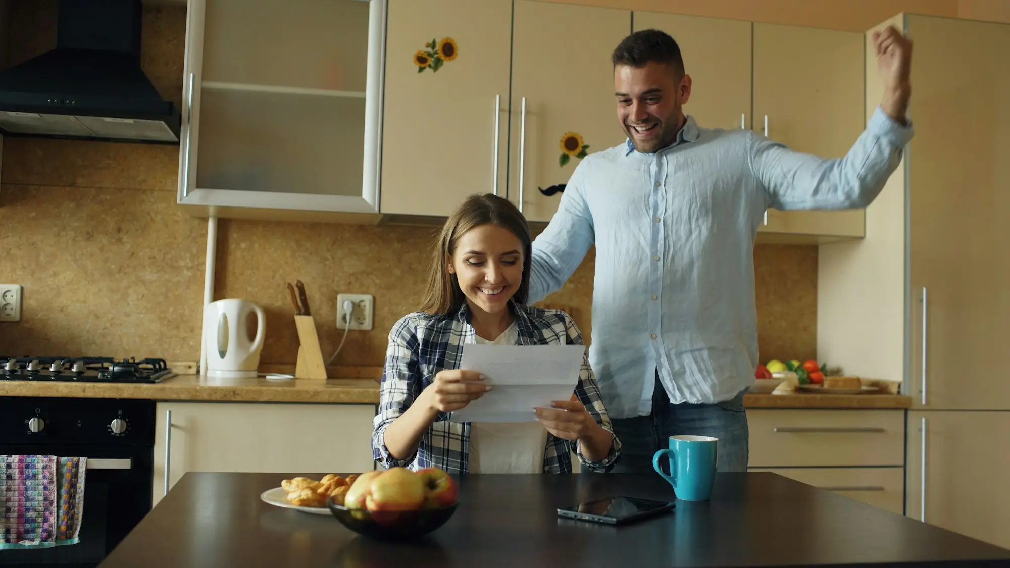 Second mortgage couple kitchen table paperwork
